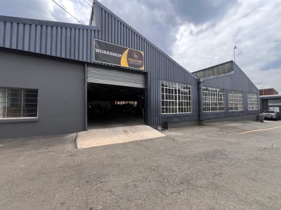 Industrial Warehouse with Cranes and Main Road Exposure
